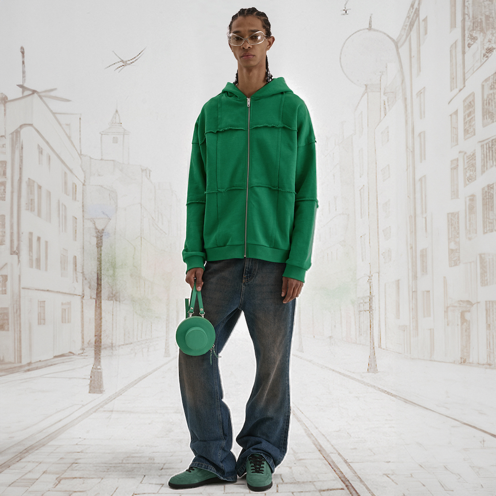 man dressing green hoodie and dark denim jeans flaneur SS24
