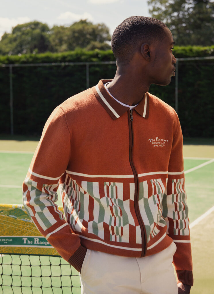 man styling clothing on tennis court